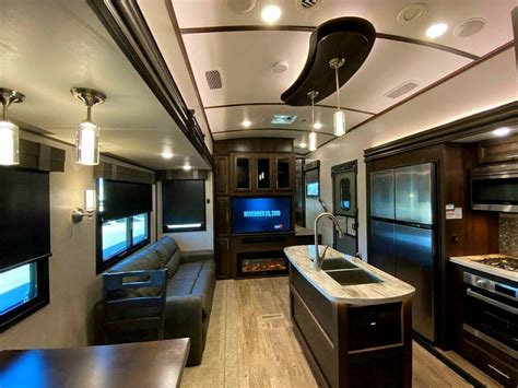 With additional living quarters over the bed of the truck, and a special hitch that helps prevent jackknifing when driving, you get versatility, utility, and comfort wherever the road may take you. . 5th wheel with bunkhouse and 2 bathrooms